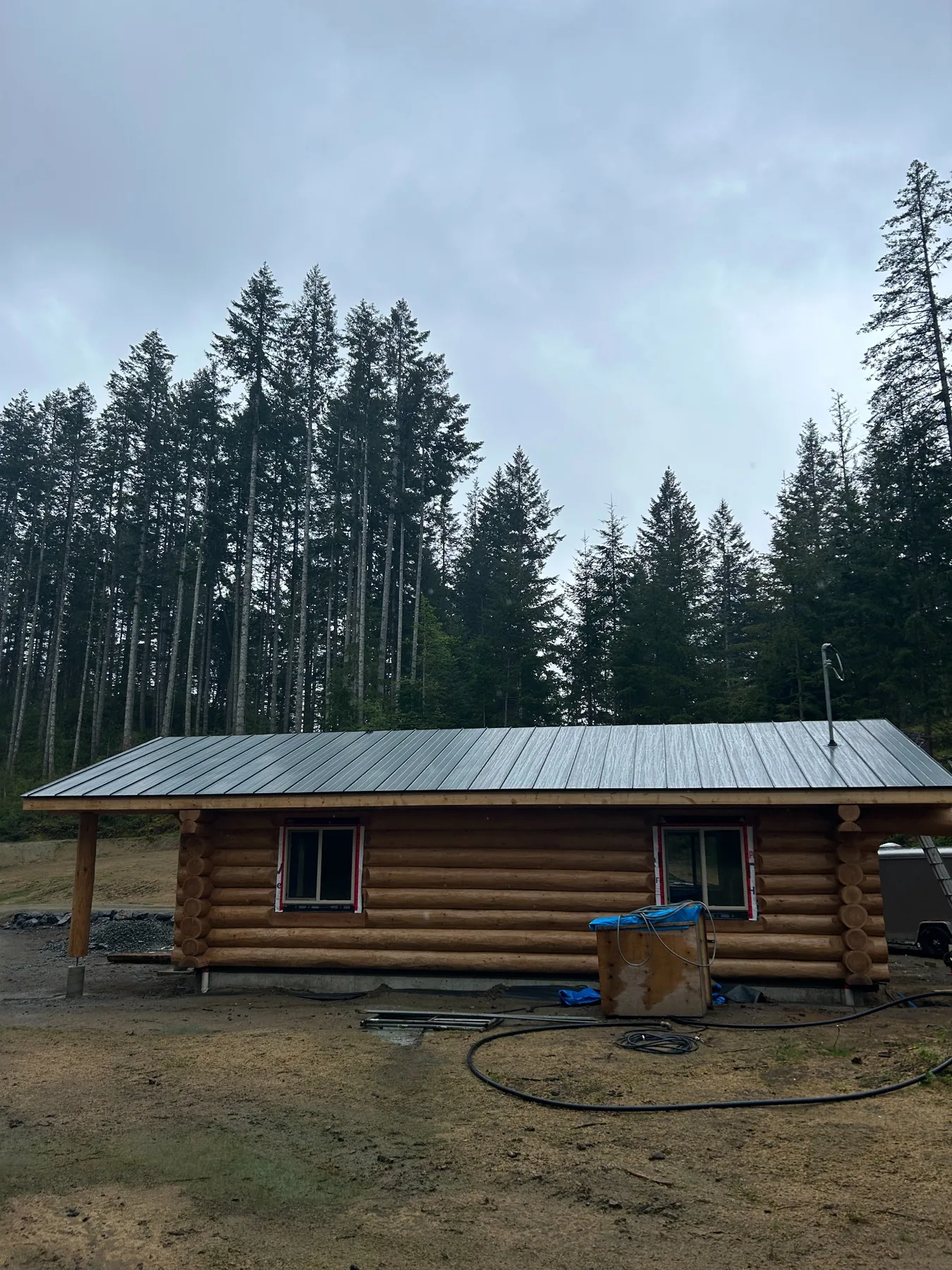 Completed metal roof on a log home