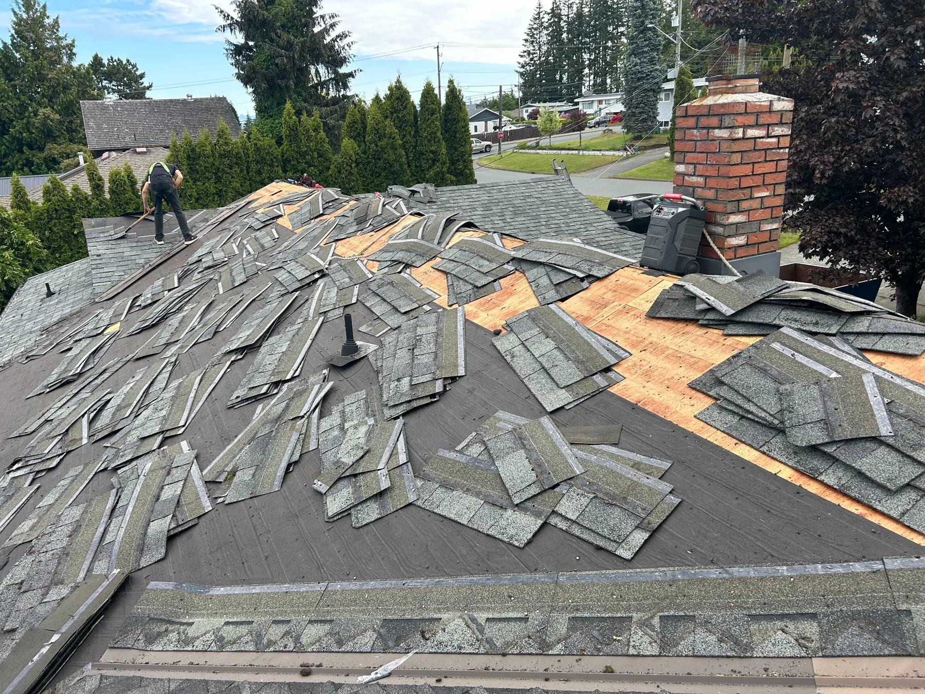 Roof repair and tear-off work in progress